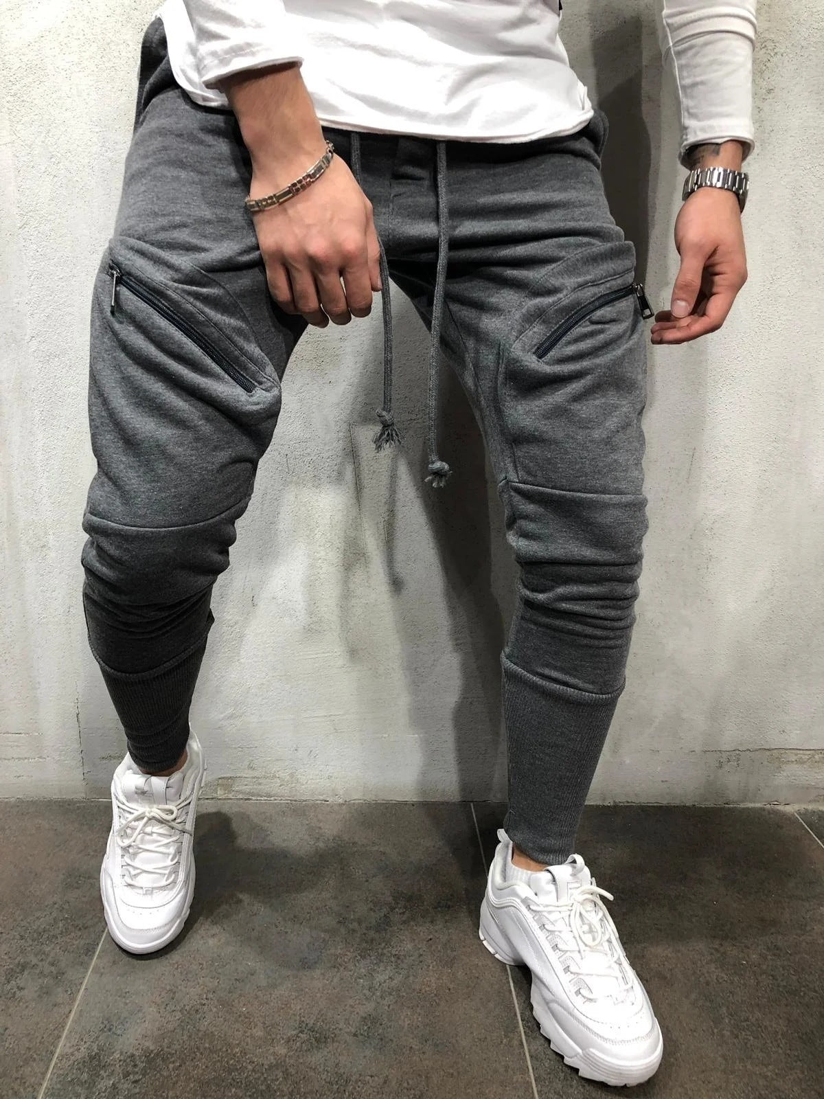 Pantalones deportivos casuales nuevos para hombre con cremallera en color liso.