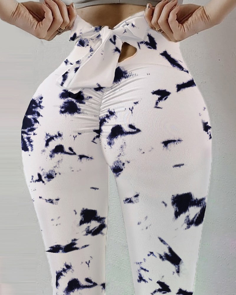 Pantalon de yoga sexy taille haute très extensible avec imprimé nœud sur les hanches