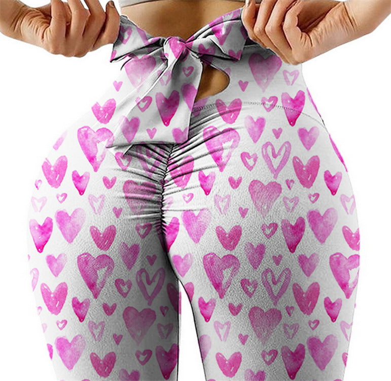 Pantalon de yoga sexy taille haute très extensible avec imprimé nœud sur les hanches