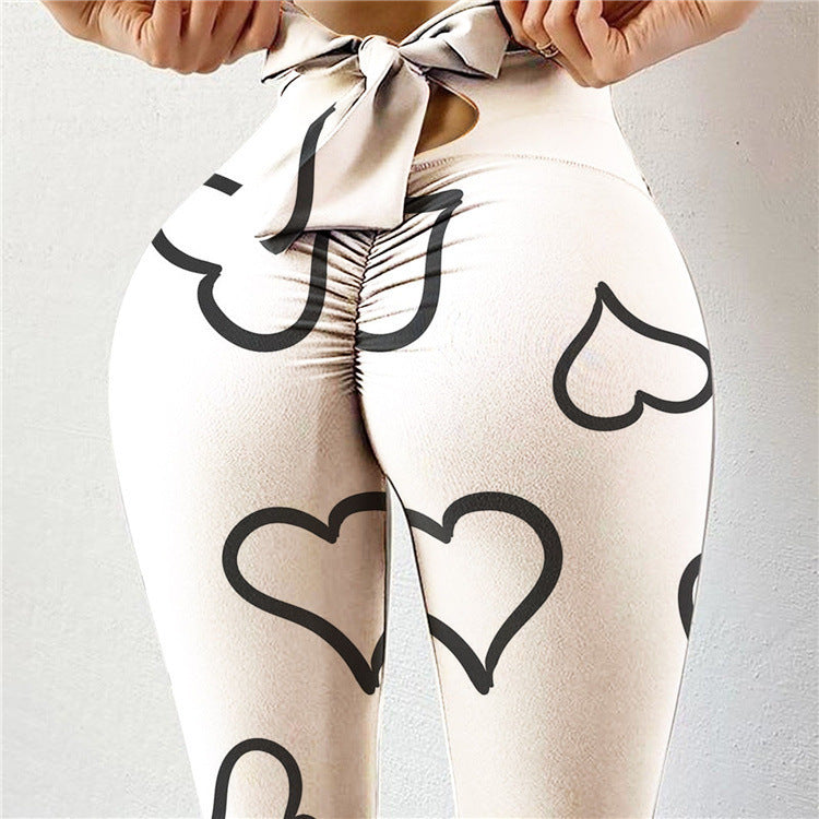 Pantalon de yoga sexy taille haute très extensible avec imprimé nœud sur les hanches