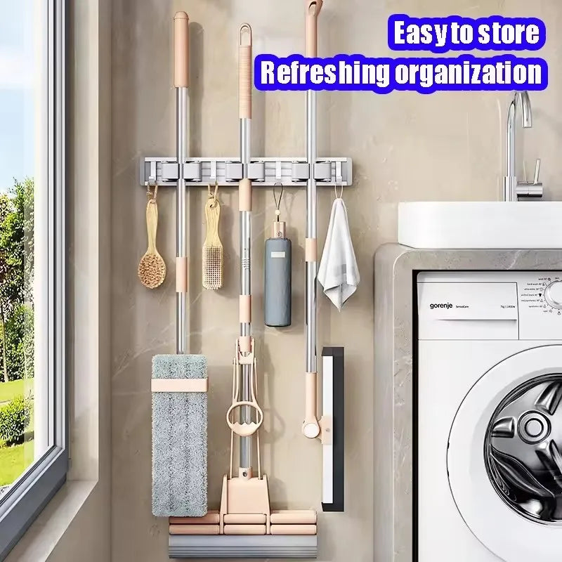 Organizador de trapeador y escoba de pared con 5 ganchos, resistente soporte autoadhesivo para trapeador, ideal para cocina, baño y almacenamiento de herramientas de limpieza.