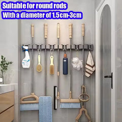Organizador de trapeador y escoba de pared con 5 ganchos, resistente soporte autoadhesivo para trapeador, ideal para cocina, baño y almacenamiento de herramientas de limpieza.