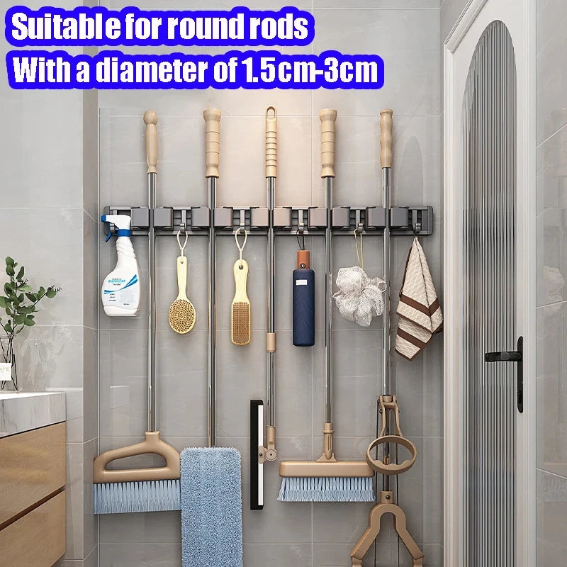 Organizador de trapeador y escoba de pared con 5 ganchos, resistente soporte autoadhesivo para trapeador, ideal para cocina, baño y almacenamiento de herramientas de limpieza.