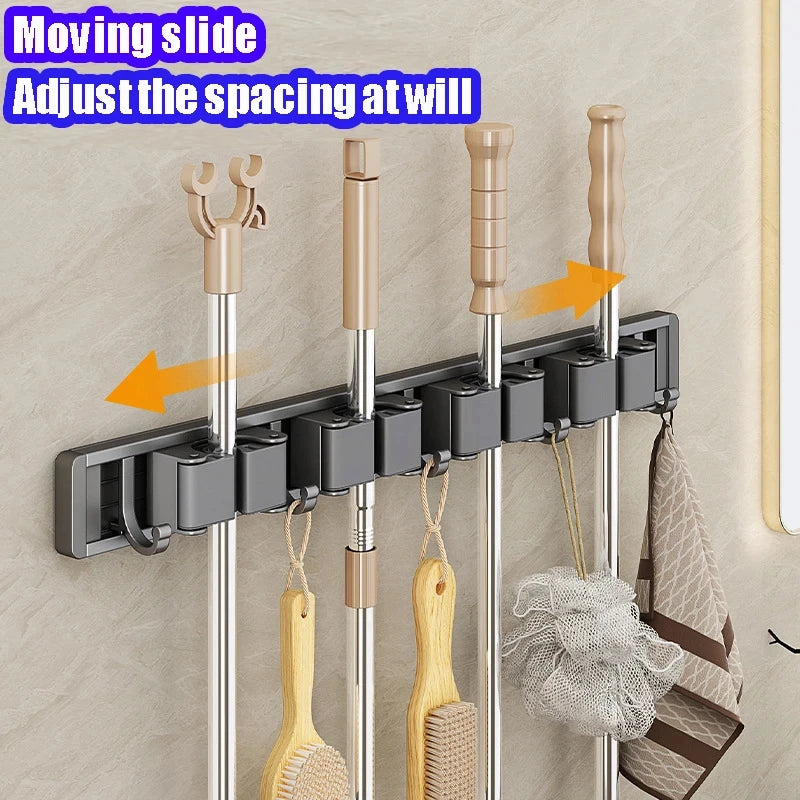 Organizador de trapeador y escoba de pared con 5 ganchos, resistente soporte autoadhesivo para trapeador, ideal para cocina, baño y almacenamiento de herramientas de limpieza.