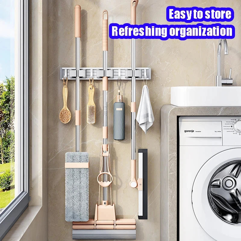 Organizador de trapeador y escoba de pared con 5 ganchos, resistente soporte autoadhesivo para trapeador, ideal para cocina, baño y almacenamiento de herramientas de limpieza.