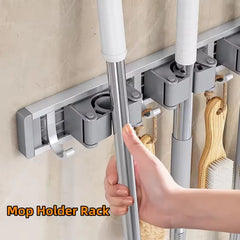 Organizador de trapeador y escoba de pared con 5 ganchos, resistente soporte autoadhesivo para trapeador, ideal para cocina, baño y almacenamiento de herramientas de limpieza.