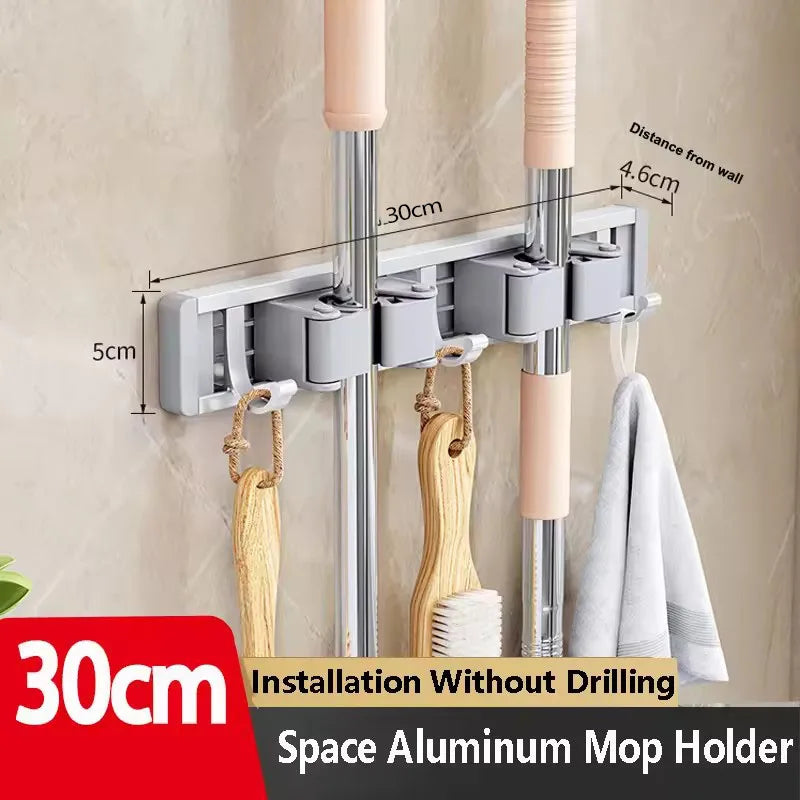 Organizador de trapeador y escoba de pared con 5 ganchos, resistente soporte autoadhesivo para trapeador, ideal para cocina, baño y almacenamiento de herramientas de limpieza.