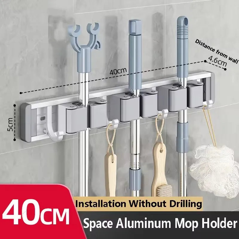 Organizador de trapeador y escoba de pared con 5 ganchos, resistente soporte autoadhesivo para trapeador, ideal para cocina, baño y almacenamiento de herramientas de limpieza.