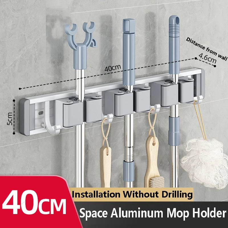 Organizador de trapeador y escoba de pared con 5 ganchos, resistente soporte autoadhesivo para trapeador, ideal para cocina, baño y almacenamiento de herramientas de limpieza.