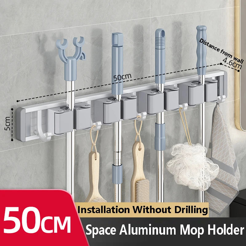 Organizador de trapeador y escoba de pared con 5 ganchos, resistente soporte autoadhesivo para trapeador, ideal para cocina, baño y almacenamiento de herramientas de limpieza.