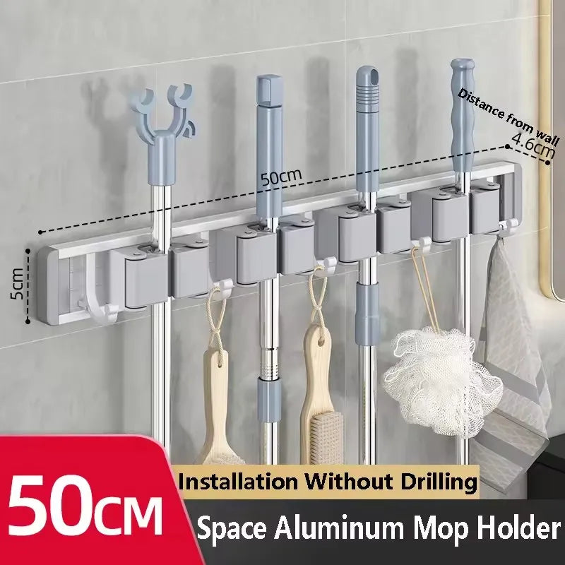 Organizador de trapeador y escoba de pared con 5 ganchos, resistente soporte autoadhesivo para trapeador, ideal para cocina, baño y almacenamiento de herramientas de limpieza.
