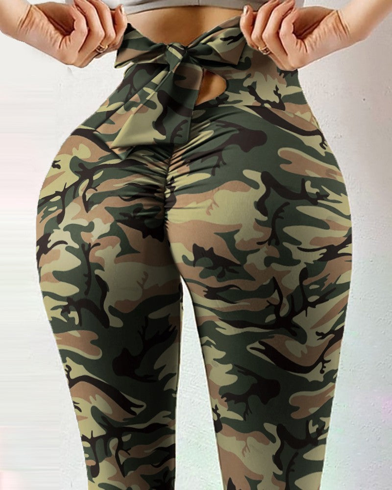 Pantalon de yoga sexy taille haute très extensible avec imprimé nœud sur les hanches